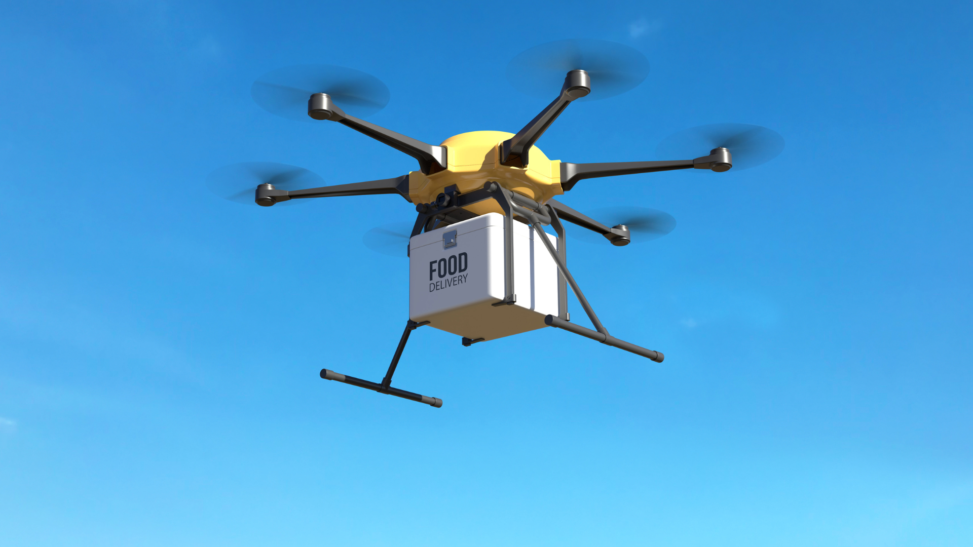 yellow drone in blue sky
