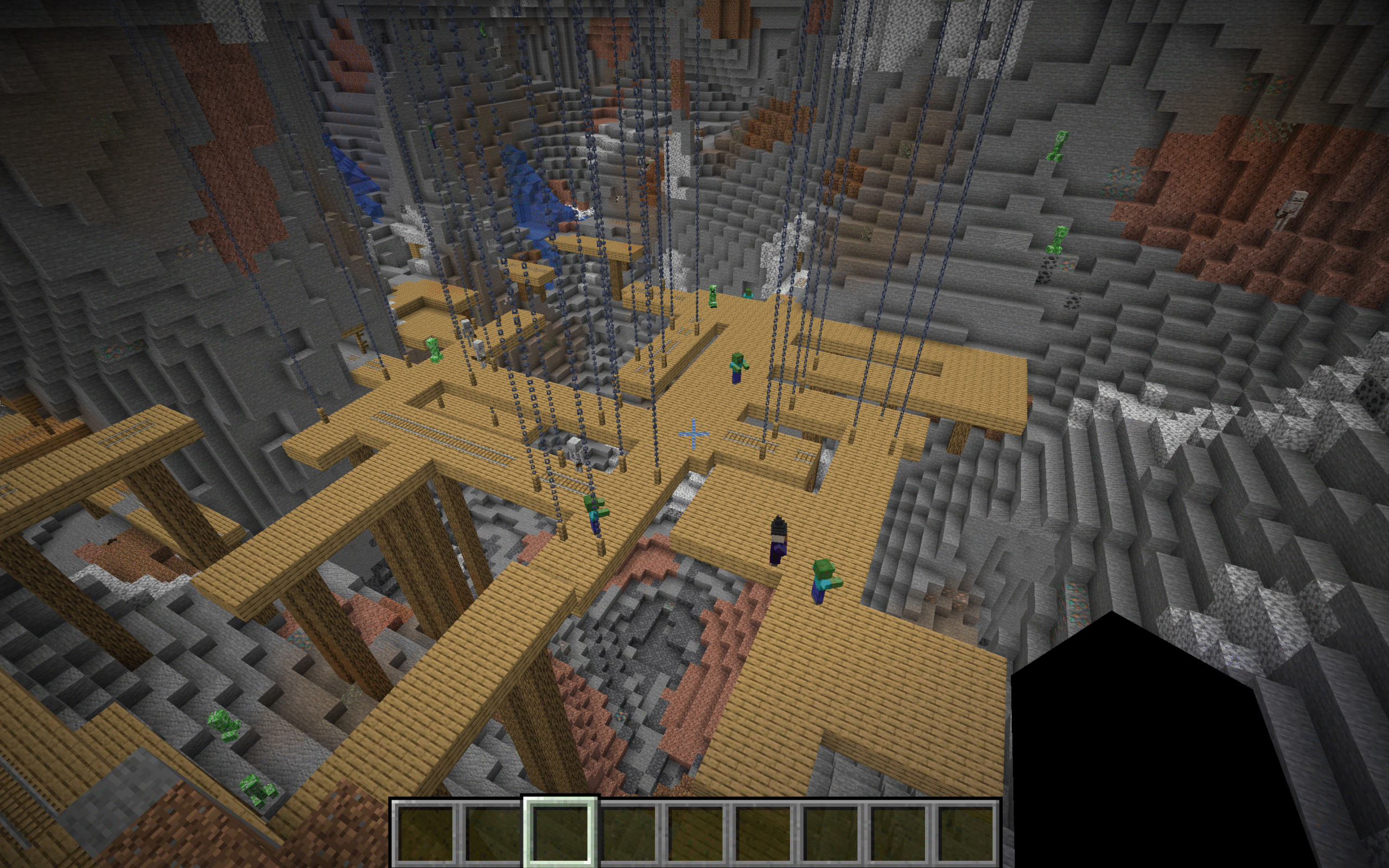 Village with exposed mineshaft visible from surface