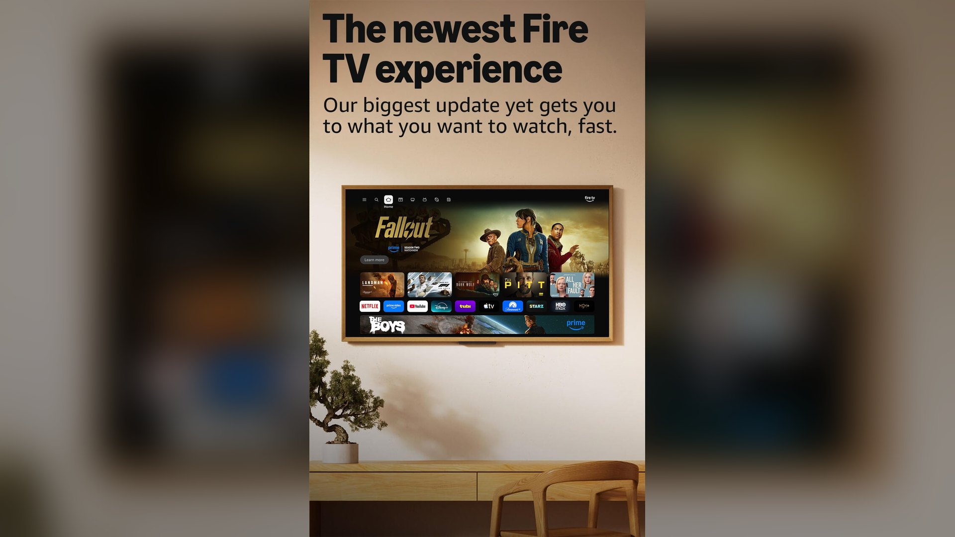 Wall-mounted TV showing the Fire TV home screen with rows of streaming apps