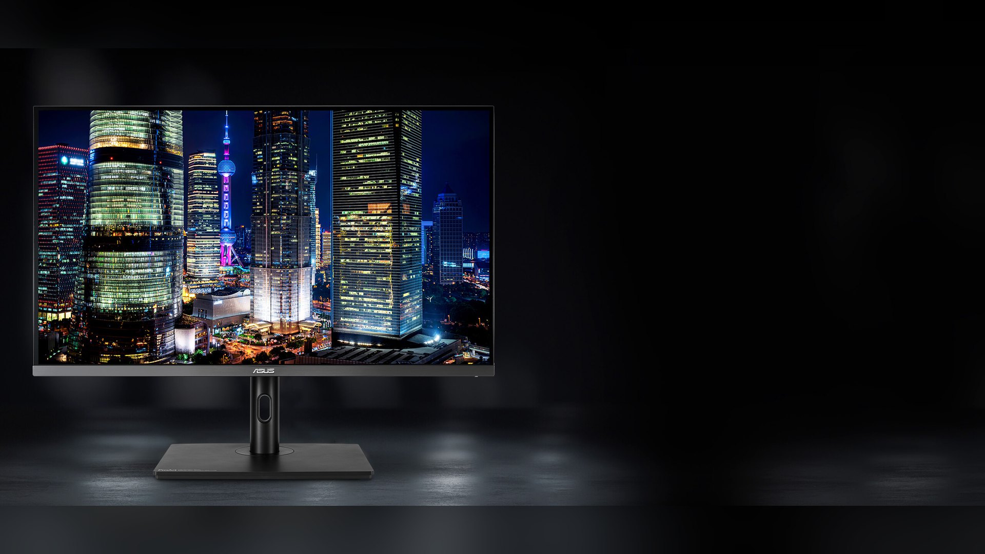 ASUS ProArt PA32UCR-K displaying a bright city skyline at night