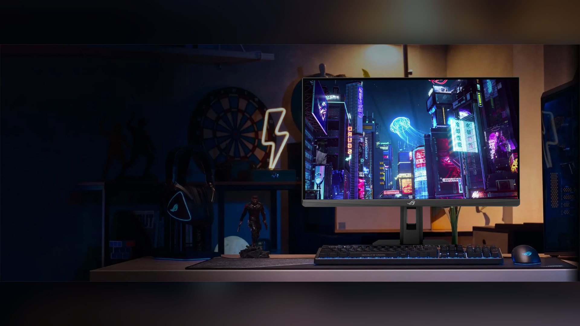 ASUS monitor in a dark room showing a colourful city scene