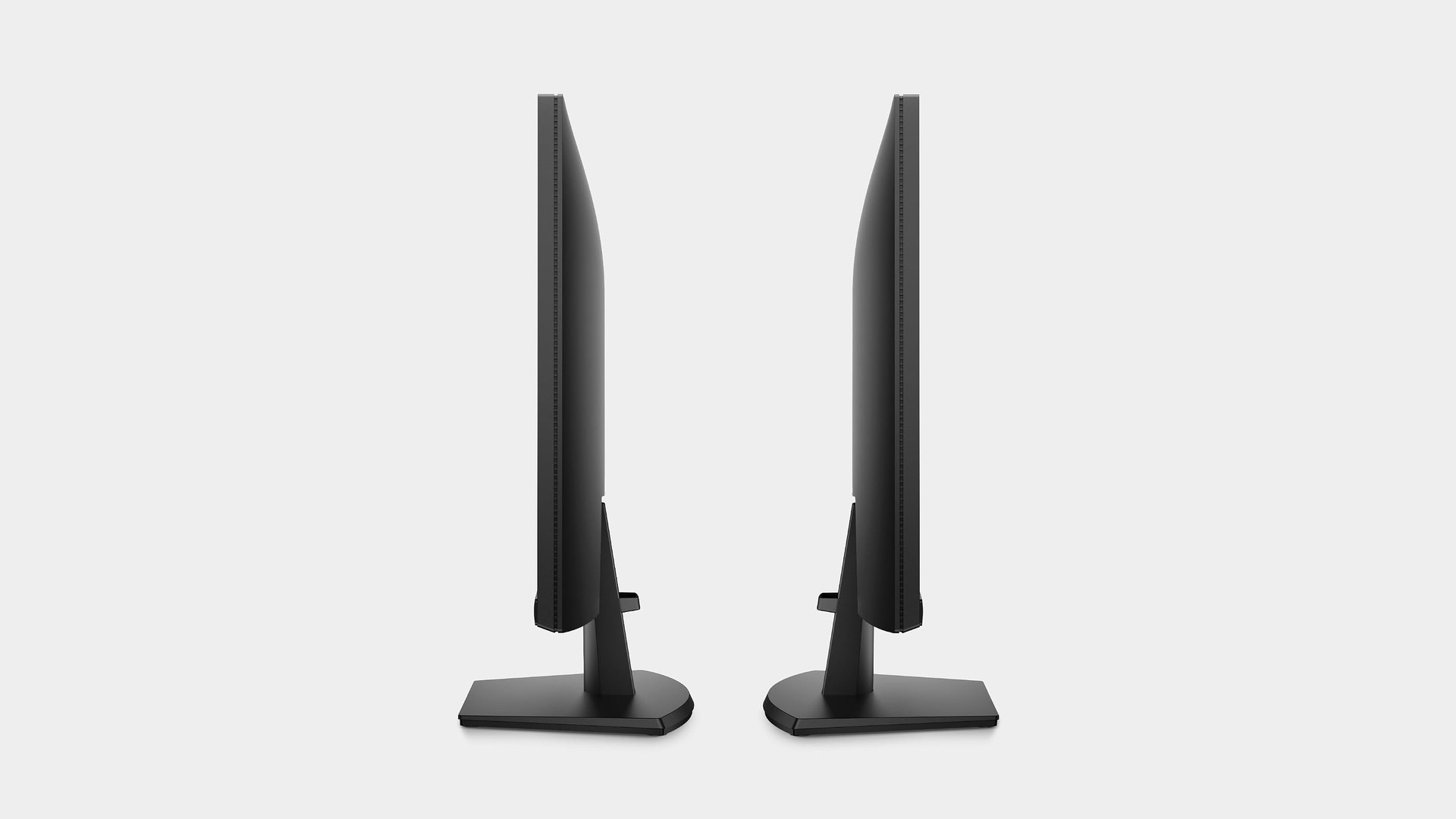 Two Dell SE2426H monitors photographed from the side showing the fixed-height stand