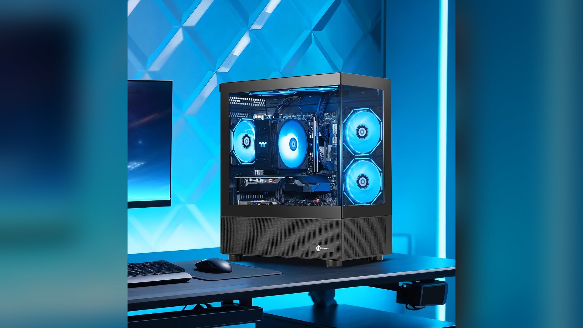 NINGMEI gaming PC tower on a desk beside a monitor