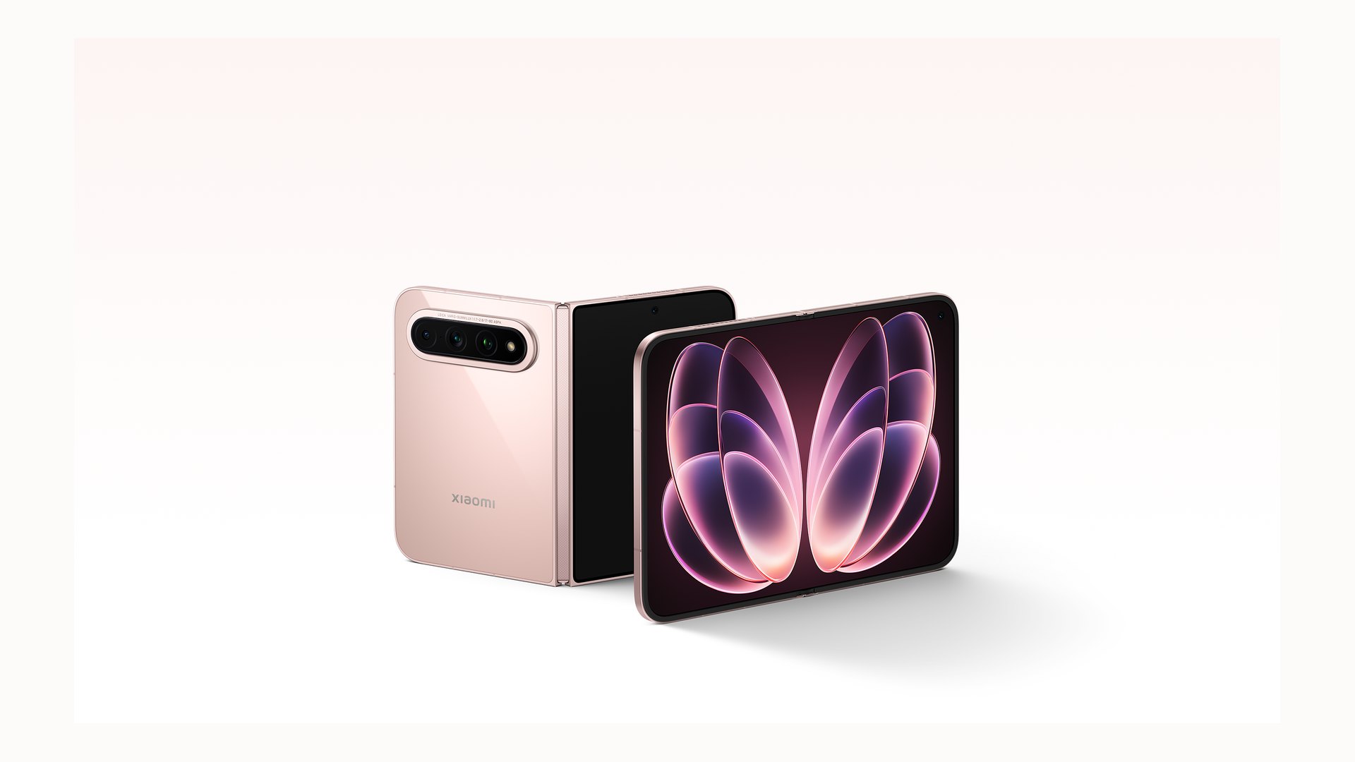 Two Xiaomi 18 Fold phones in pink, one standing closed and one opened flat