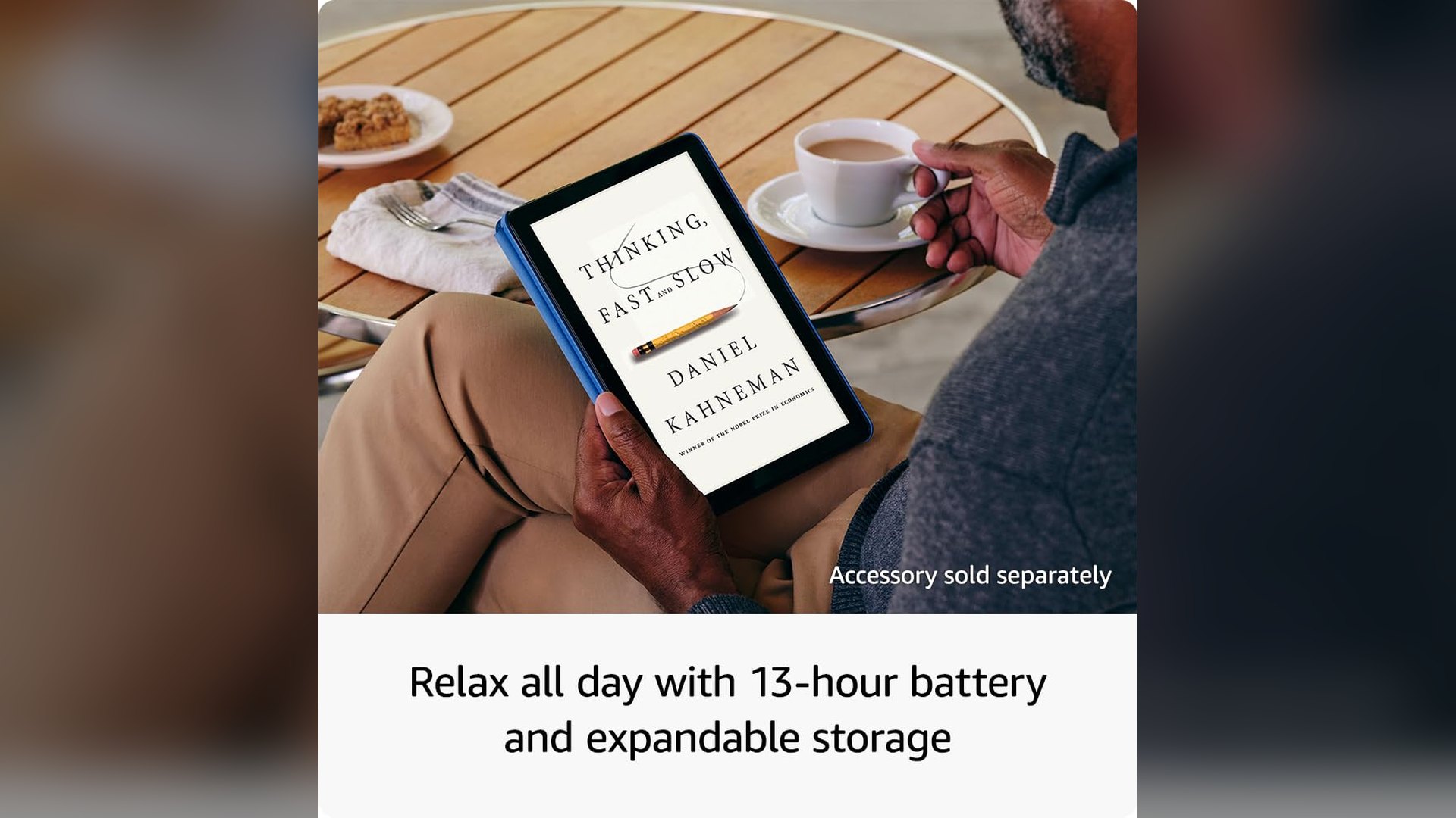 Fire HD 10 held in portrait showing an ebook page at a cafe table