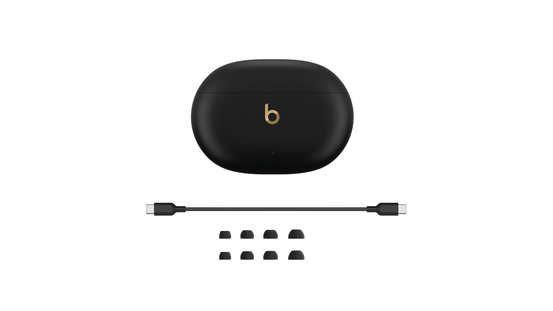 Closed Beats Studio Buds + case with a USB-C cable and four pairs of eartips below it