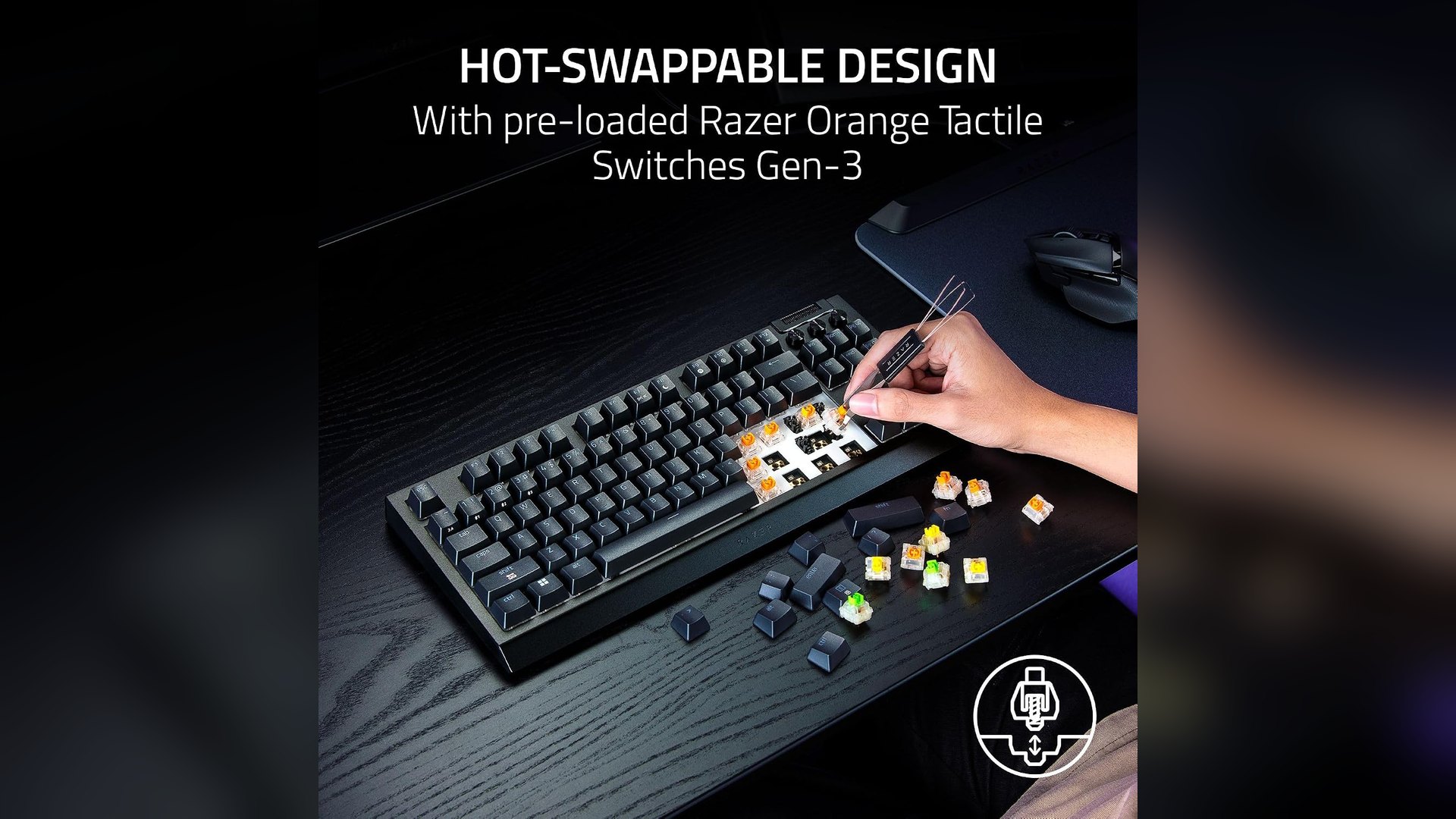A hand using a switch puller to lift keyboard switches out of the BlackWidow V4 Tenkeyless HyperSpeed