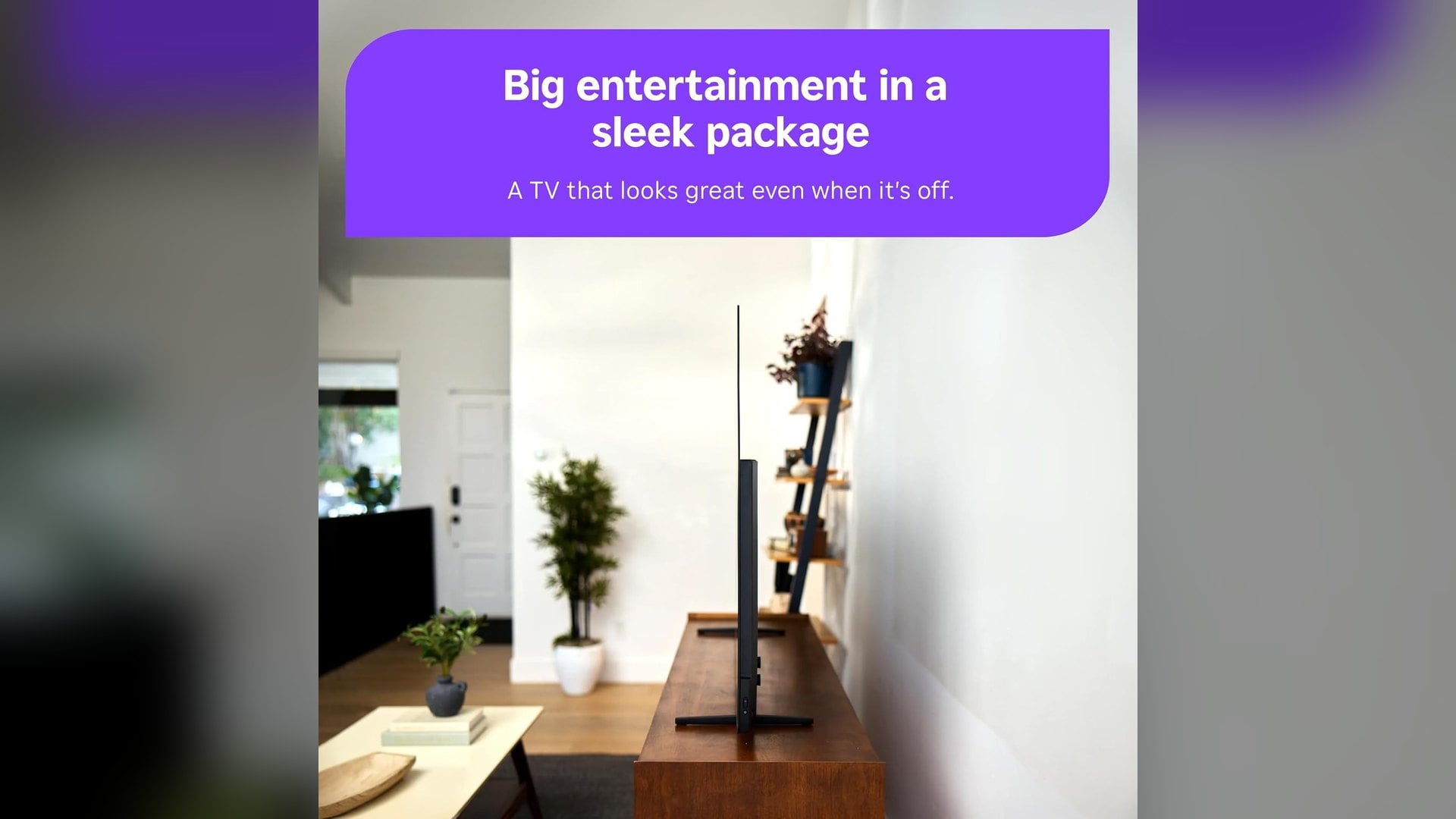 Edge-on view of a thin Roku Pro Series OLED TV on its stand
