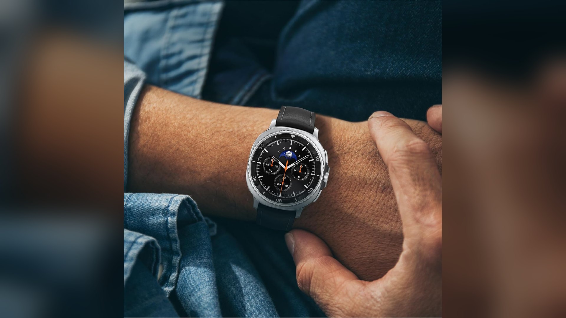 Galaxy Watch 8 Classic worn on a wrist above a denim pocket