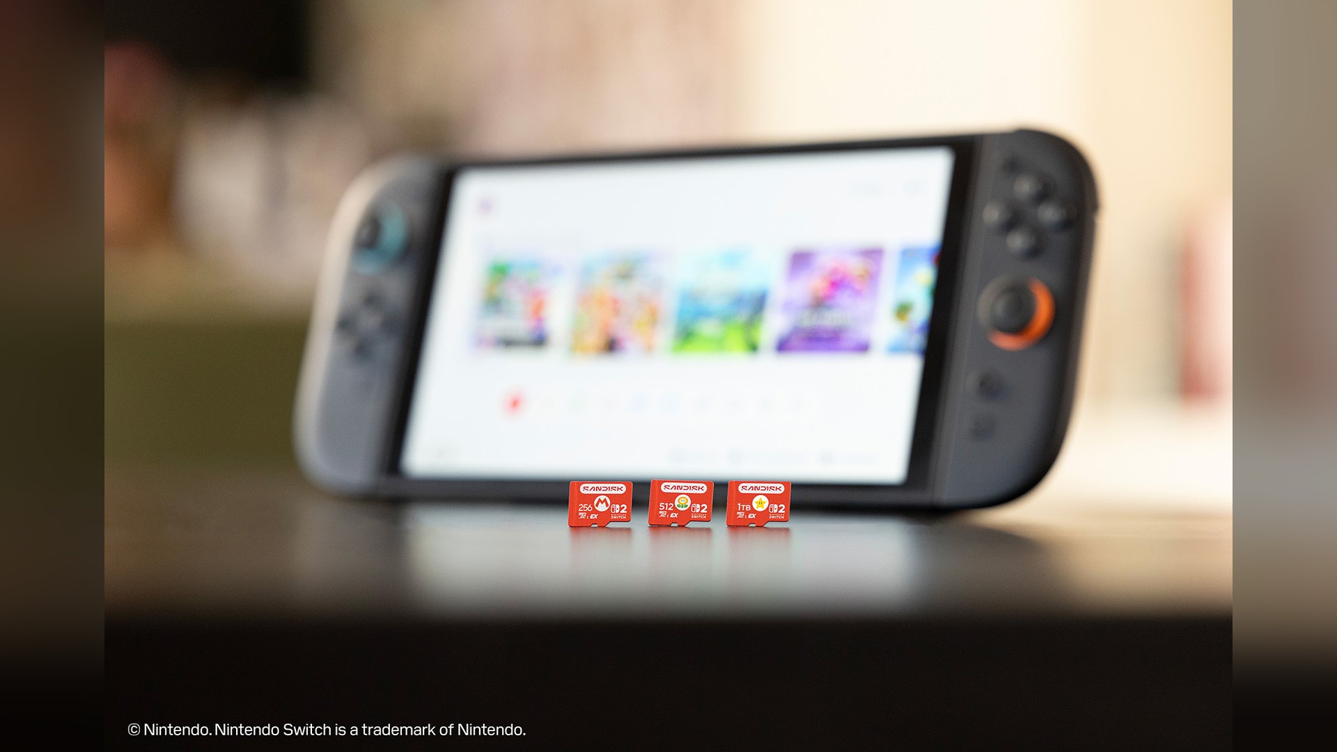 Three SanDisk microSD Express cards standing in front of a Nintendo Switch 2