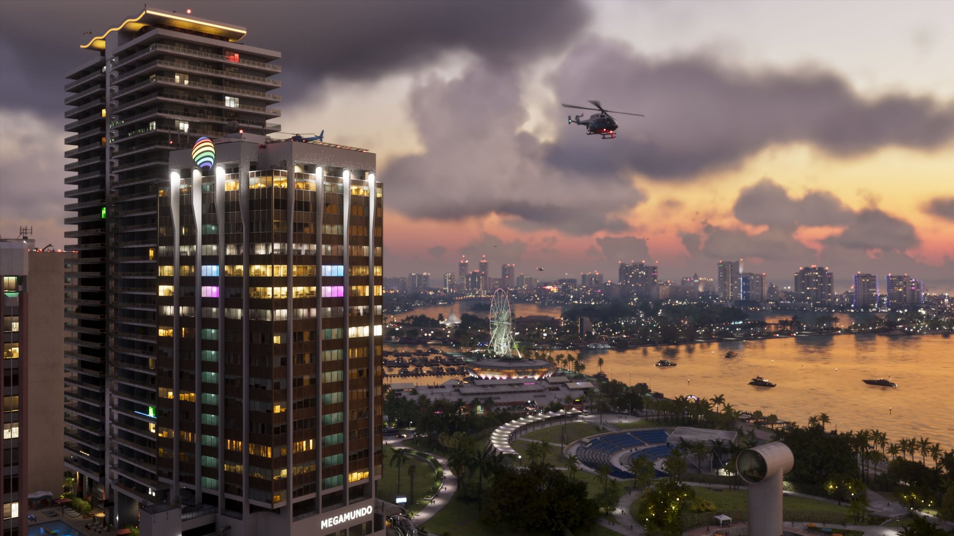 A high-rise tower overlooking the Vice City waterfront at sunset with helicopters overhead
