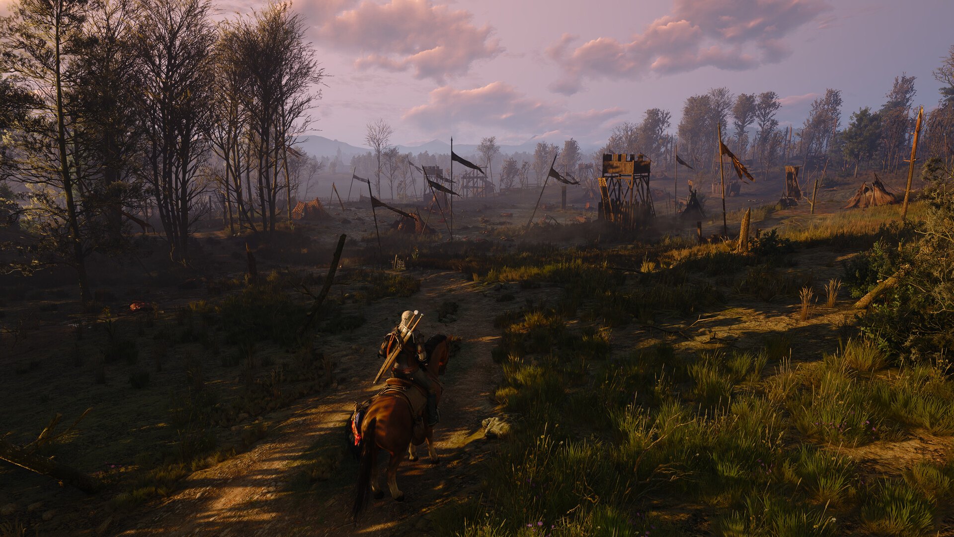 Hazy Velen landscape with gallows beside a dirt track at dusk