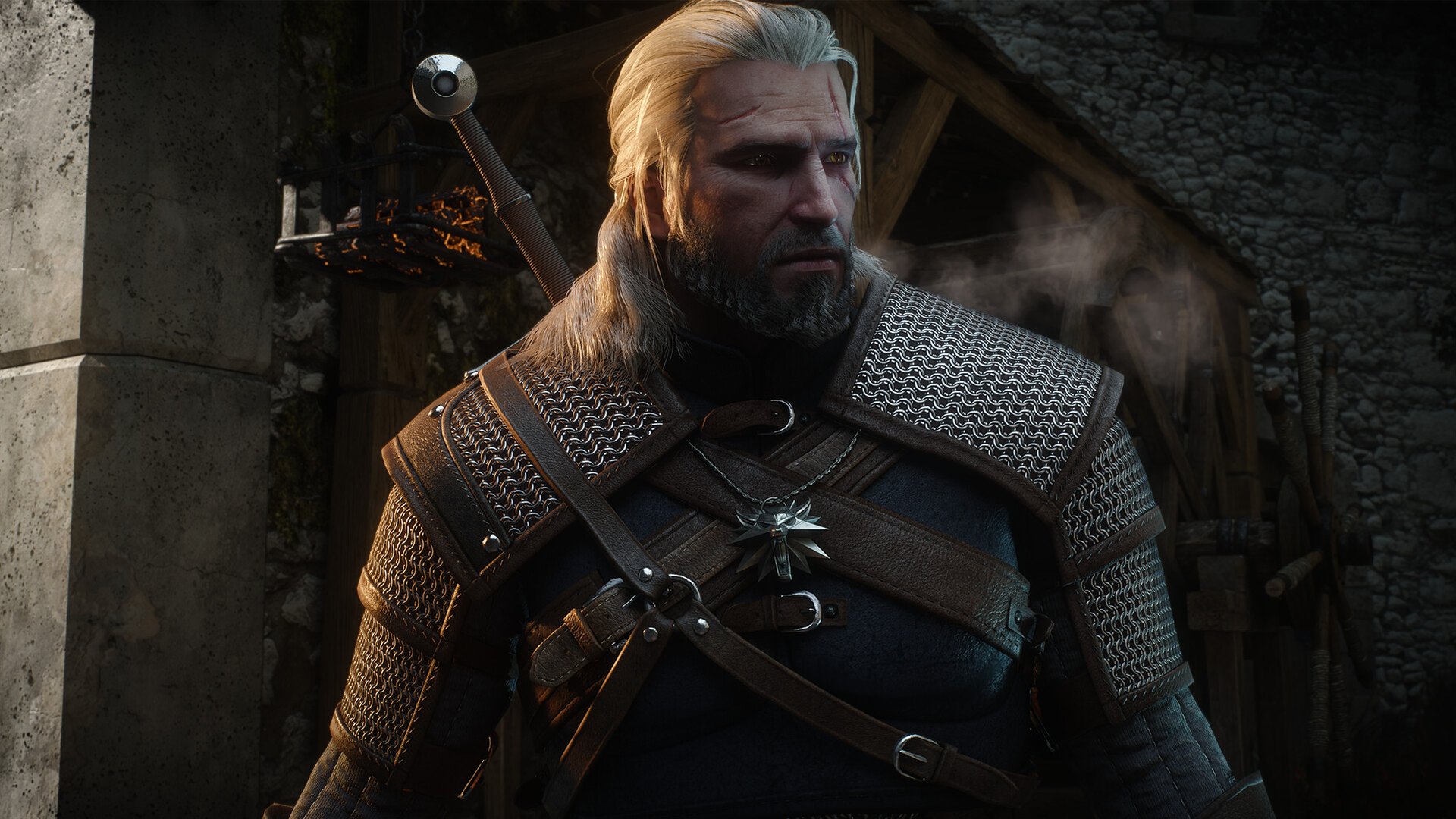 Close-up of Geralt of Rivia in armour standing in a doorway